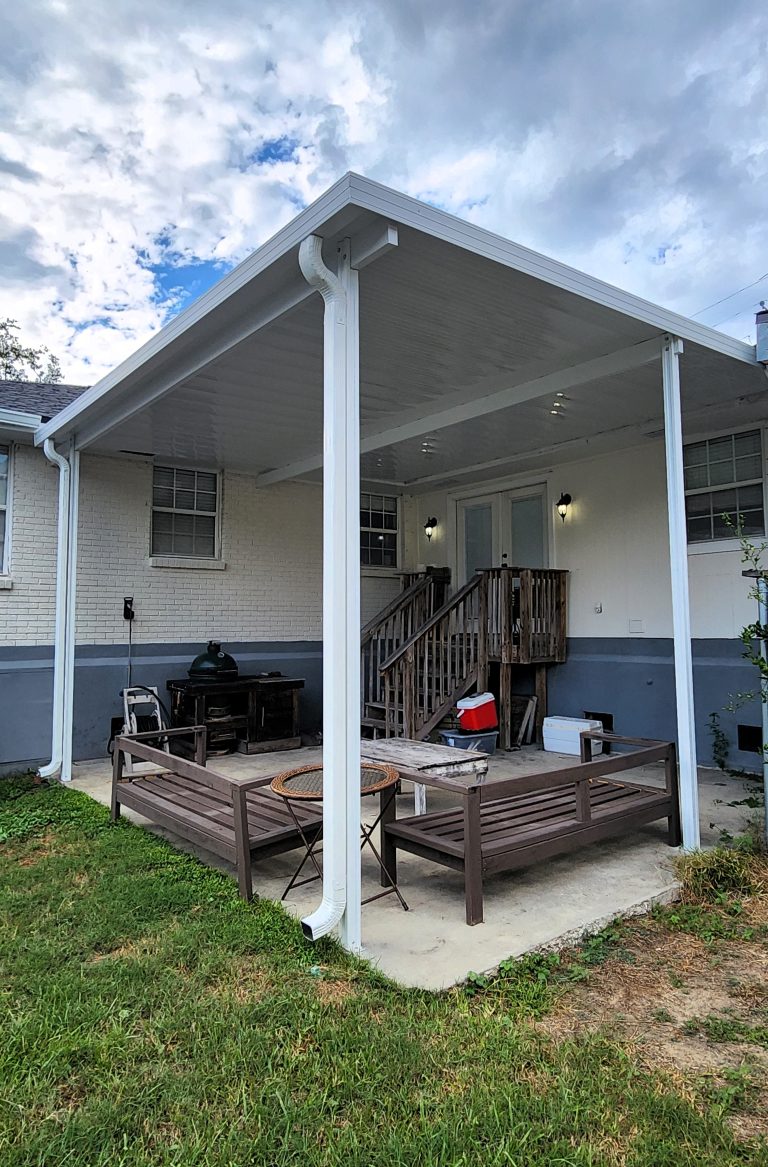 Patio cover creating shade with furnishings